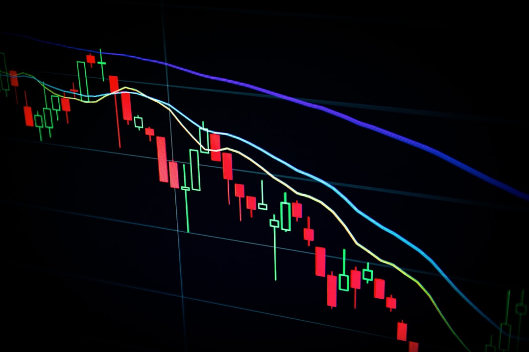 Trader analyzing bearish forex market trends on multiple screens with declining charts